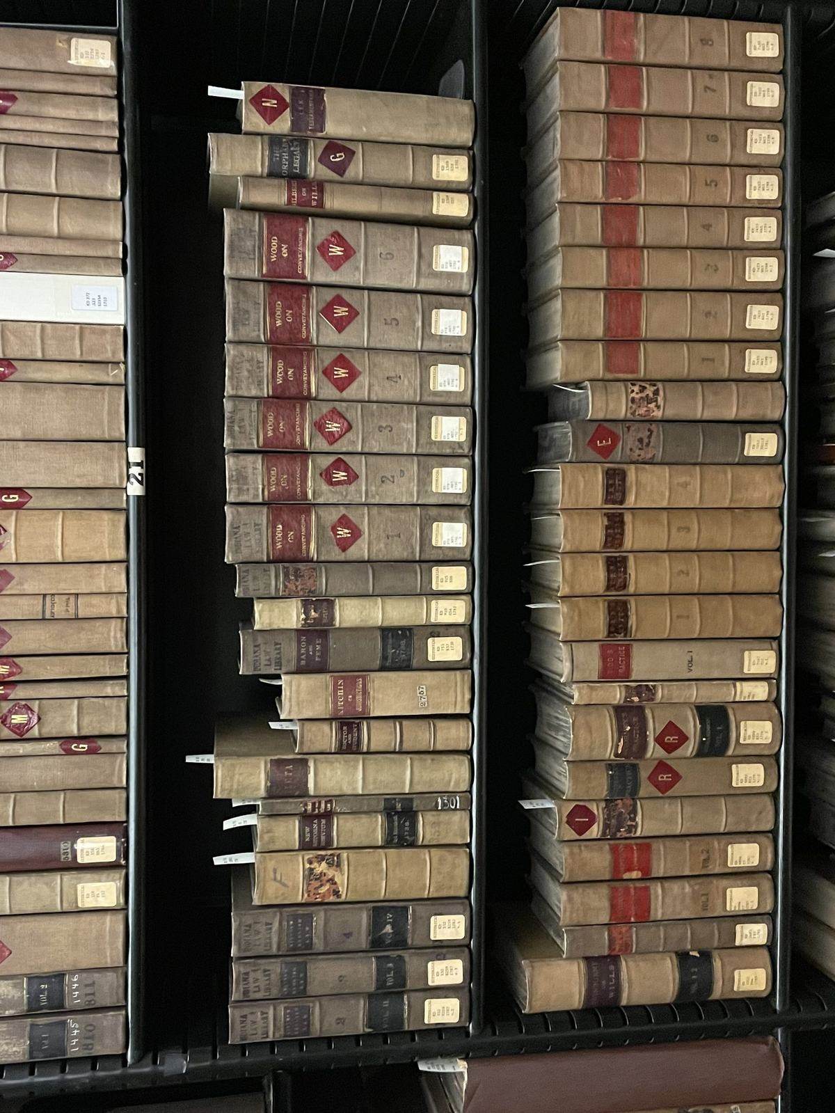 A shelf of bound law reports in a court library.